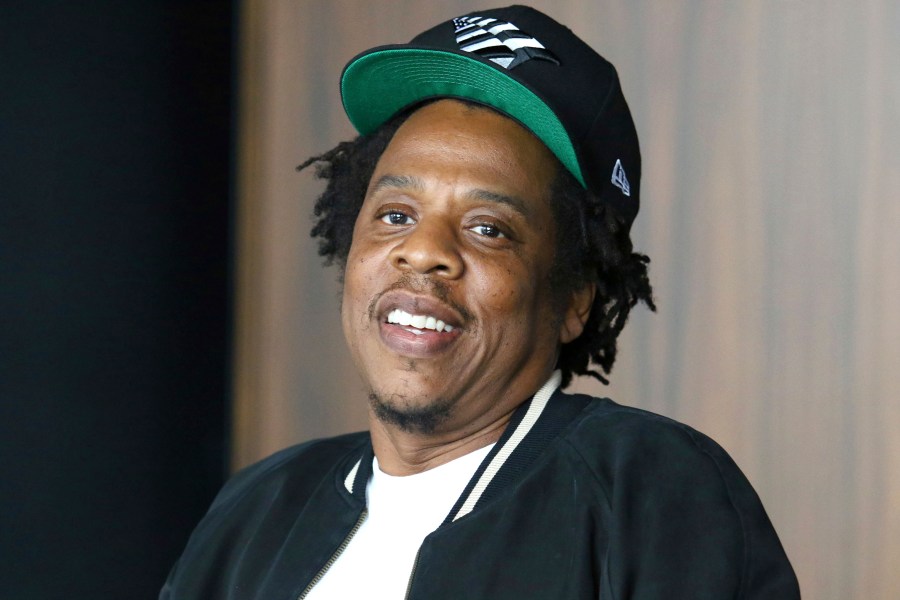 FILE - In this July 23, 2019, file photo, Jay-Z makes an announcement of the launch of Dream Chasers record label in joint venture with Roc Nation, at the Roc Nation headquarters in New York. Moet Hennessy is acquiring a 50% stake in the rapper and entrepreneur's Champagne brand, Armand de Brignac, in an effort to up its cool factor and expand sales. Jay-Z, whose real name is Shawn Carter, said the partnership will help Armand de Brignac grow and flourish.  (Photo by Greg Allen/Invision/AP, File)