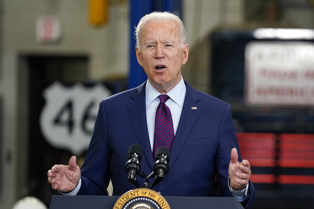 In this June 29, 2021, file photo President Joe Biden speaks about infrastructure spending at the La Crosse Municipal Transit Authority in La Crosse, Wis. President Joe Biden speaks volumes when he whispers. And his whispers during recent public appearances are attracting attention. The White House and communications experts say it's Biden's way of trying to make a connection while emphasizing a point. (AP Photo/Evan Vucci, File)