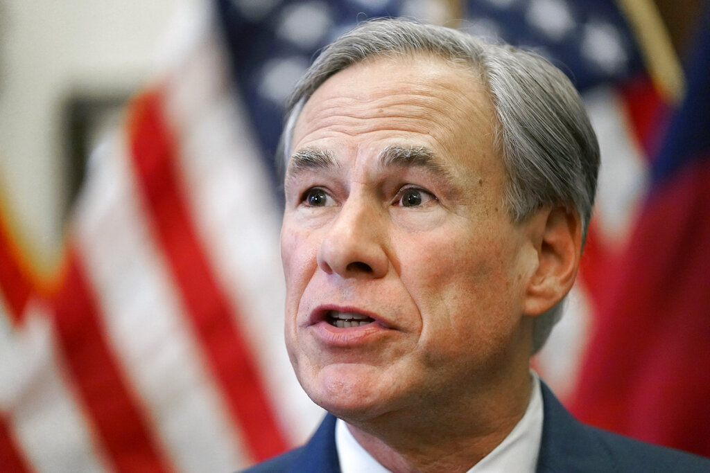 Texas Gov. Greg Abbott speaks at a news conference in Austin, Texas. Abbott, who faces a contested reelection primary next year, is pushing looser gun laws than he ever previously embraced and proposing unprecedented state actions, including promises to build more walls on the Mexican border. Similar scenes are playing out in campaigns in other red states including Arkansas and Idaho, where ultra right-wing challengers are tapping into anger among Republicans over Trump’s election loss and coronavirus-related lockdowns. (AP Photo/Eric Gay, File)