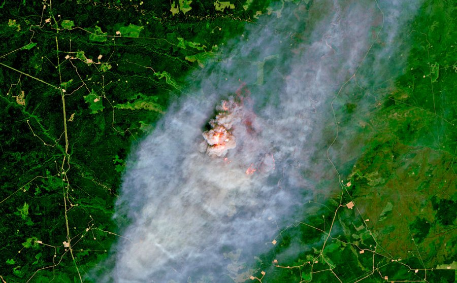 This satellite image provided by European Union, Copernicus Sentinel-2 data (processed by Spacetec) shows a wildfire burning 40 km (about 25 miles) northeast of Pink Mountain in British Columbia. (European Union, Copernicus Sentinel-2 data via AP)