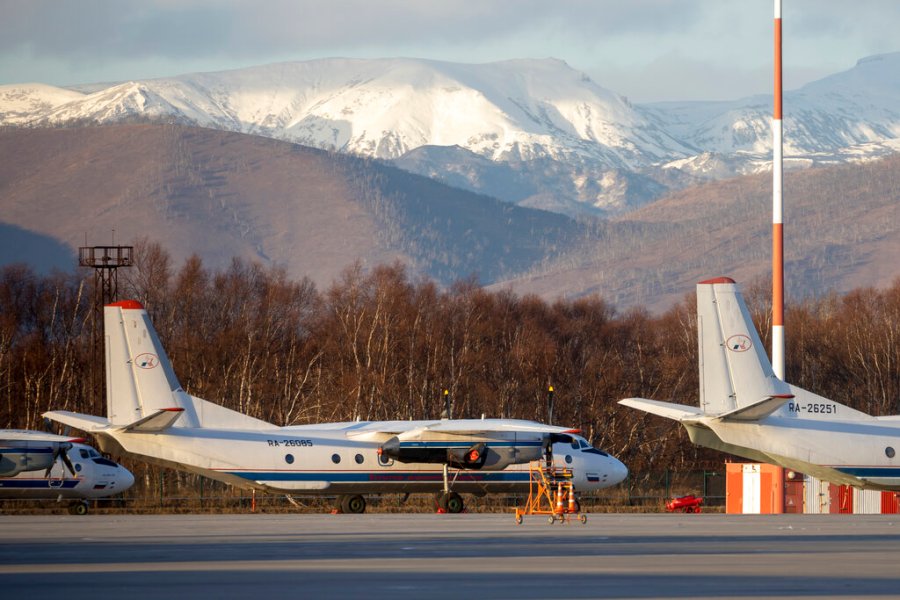 An Antonov An-26 with the same number #RA-26085 as the missed plane is parked at Airport Elizovo outside Petropavlovsk-Kamchatsky, Russia, Tuesday, Nov. 17, 2020. Local officials say the plane with 28 people on board has gone missing in the Russian Far East region of Kamchatka. Emergency officials say the Antonov An-26 plane with 22 passengers and six crew members missed a scheduled communication while it was flying Tuesday from the city of Petropavlovsk-Kamchatsky to the village of Palana. (AP Photo/Marina Lystseva)