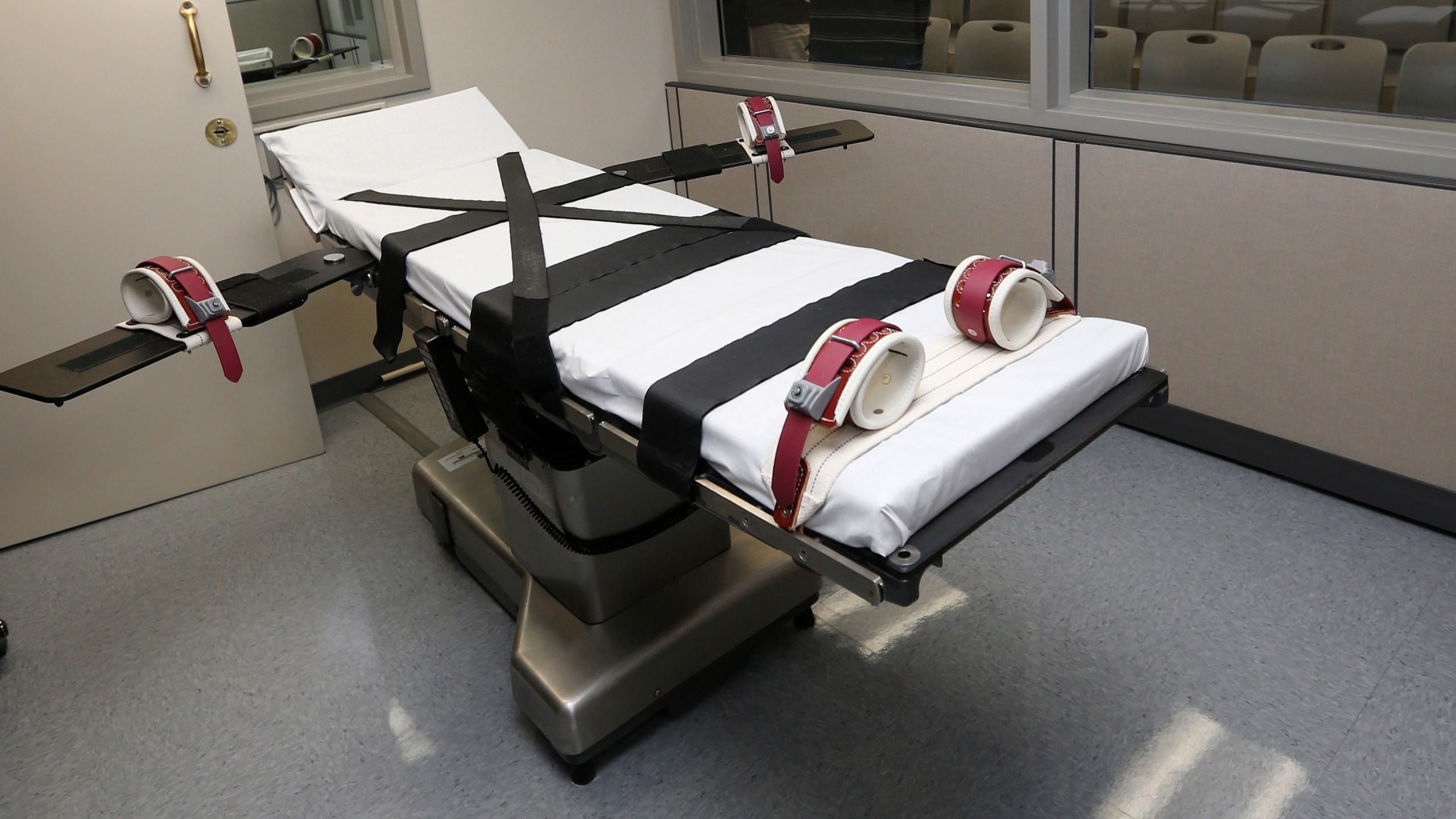 FILE - This Oct. 9, 2014, file photo shows the gurney in the the execution chamber at the Oklahoma State Penitentiary in McAlester, Okla. A 60-year-old Oklahoma man who stabbed a prison cafeteria worker to death in 1998 is scheduled to receive a lethal injection Thursday, Oct. 28, 2021 in the state's first attempt to administer the death penalty since a series of flawed executions more than six years ago. The state was moving forward with John Marion Grant's lethal injection after the U.S. Supreme Court, in a 5-3 decision, lifted stays of execution that were put in place on Wednesday for Grant and another death row inmate, Julius Jones, by the 10th U.S. Circuit Court of Appeals. (AP Photo/Sue Ogrocki, File)