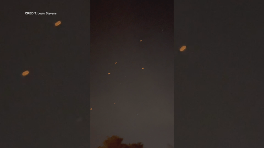 Strange lights are depicted in a dark sky.