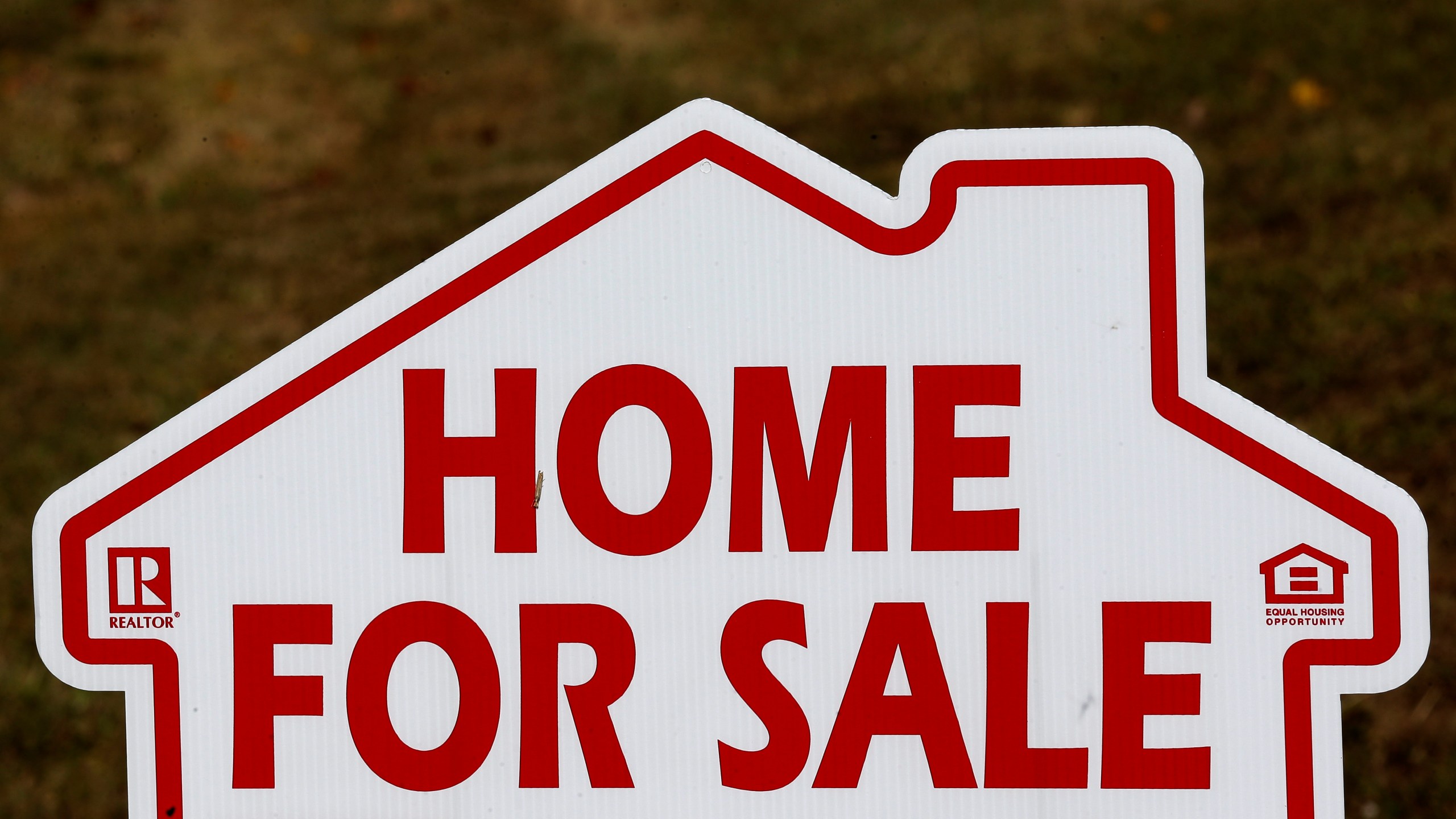 A "for sale" sign in front of a home in Florida.