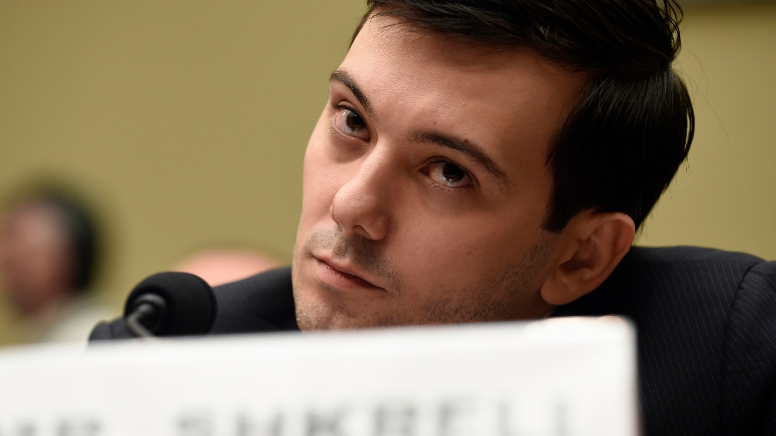 FILE - Former Turing Pharmaceuticals CEO Martin Shkreli attends the House Committee on Oversight and Reform Committee hearing on Capitol Hill in Washington, Feb. 4, 2016. A federal judge on Friday, Jan. 14, 2022 ordered Shkreli to return $64.6 million in profits he and his company reaped from inflating the price of the life-saving drug Daraprim and barred him from participating in the pharmaceutical industry for the rest of his life. (AP Photo/Susan Walsh, File)