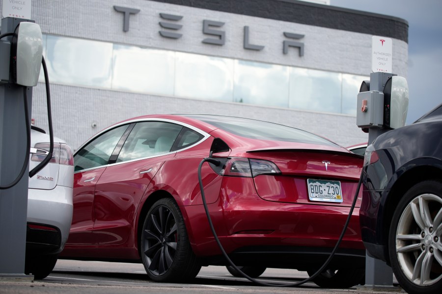 A 2021 Model 3 sedan sits in a near-empty lot at a Tesla dealership in Littleton, Colo. June 27, 2021.