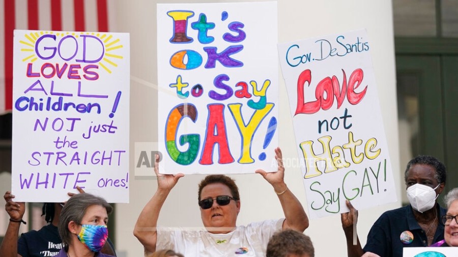 Demonstrators gather to speak on the steps of the Florida Historic Capitol Museum in front of the Florida State Capitol, Monday, March 7, 2022, in Tallahassee, Fla. Florida House Republicans advanced a bill, dubbed by opponents as the "Don't Say Gay" bill, to forbid discussions of sexual orientation and gender identity in schools, rejecting criticism from Democrats who said the proposal demonizes LGBTQ people.