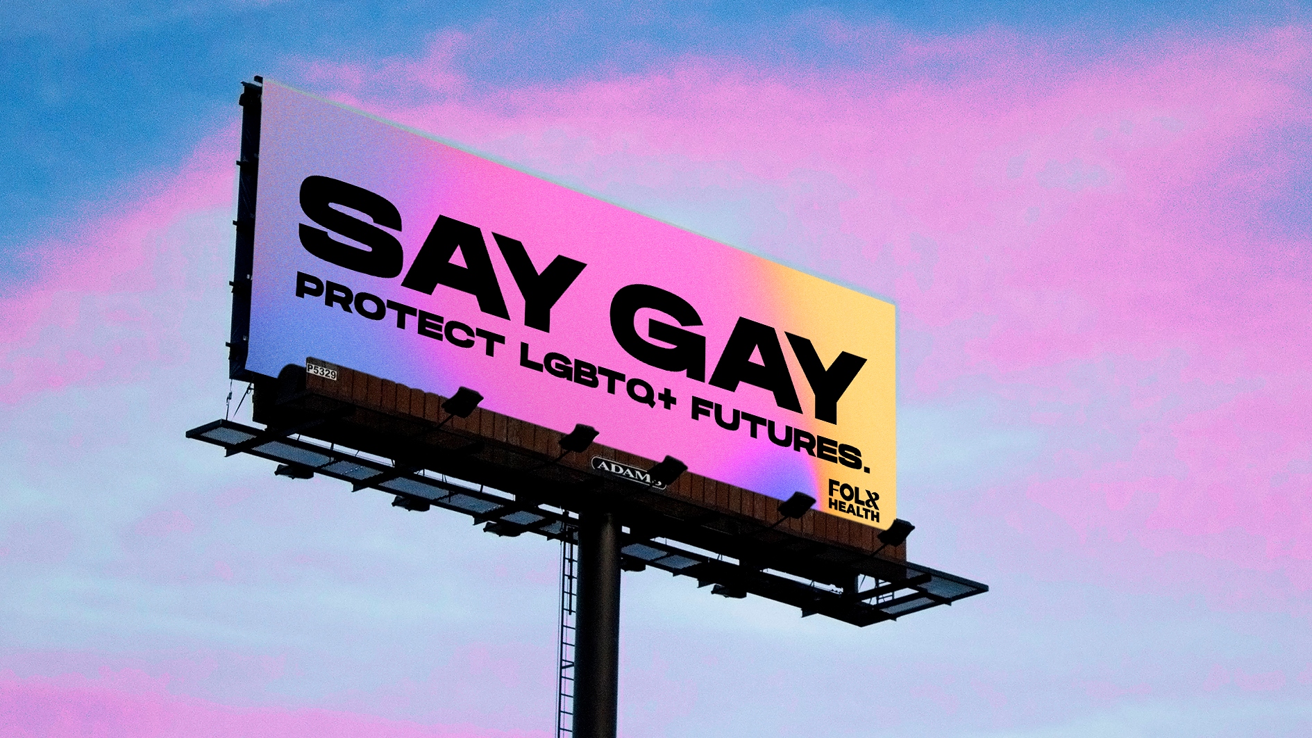 Billboard reading "Say Gay: Protect LGBTQ+ Futures" against a sunset