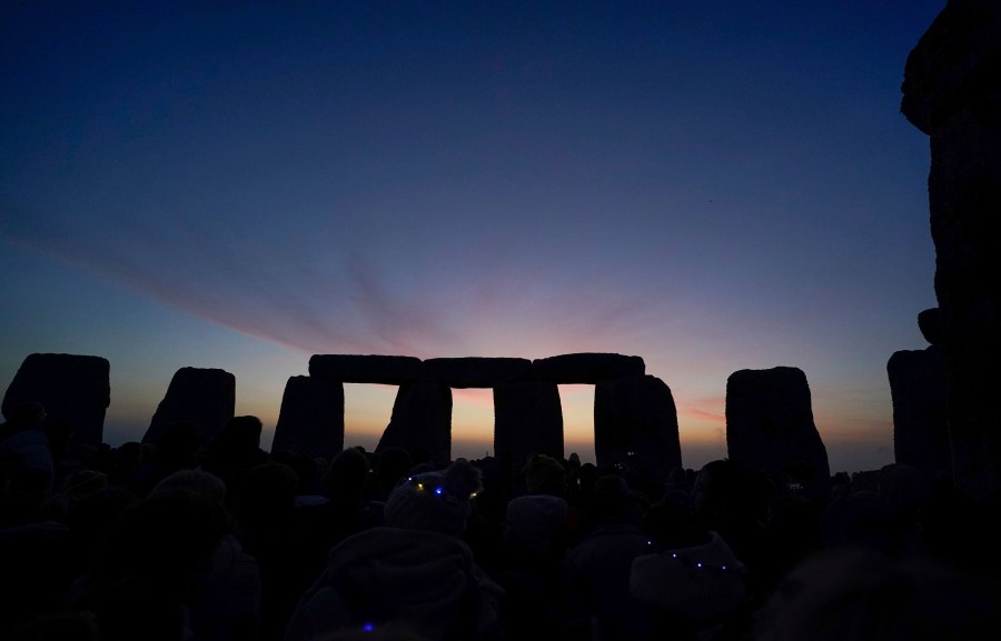 Stonehenge in front of sunrise.