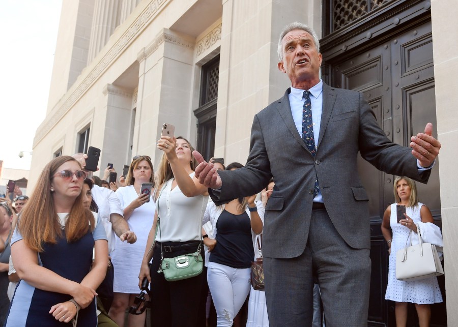 Robert F. Kennedy speaks in front of a courthouse.