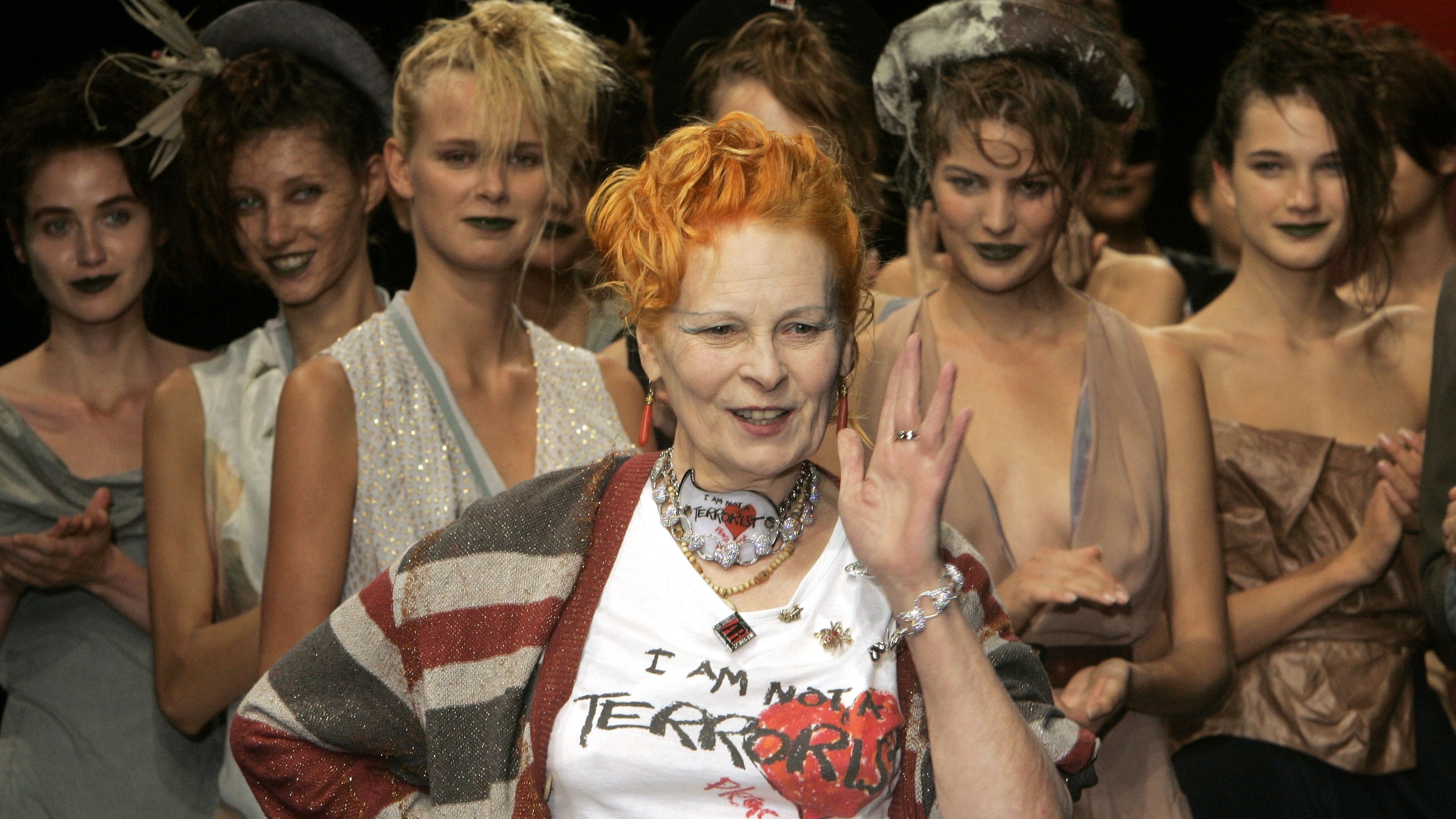 Models applaud as British fashion designer Vivienne Westwood salutes the public after the presentation of her Spring/Summer 2006 collection in Paris, Tuesday, Oct. 4, 2005. (AP Photo/Michel Euler)