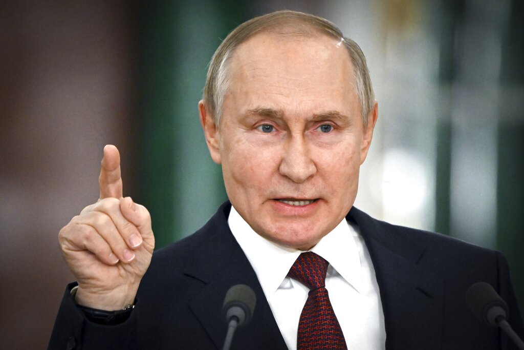 FILE - Russian President Vladimir Putin gestures while speaking at a news conference following a meeting of the State Council at the Kremlin in Moscow, Russia on Dec. 22, 2022. (Sergey Guneyev, Sputnik, Kremlin Pool Photo via AP, File)