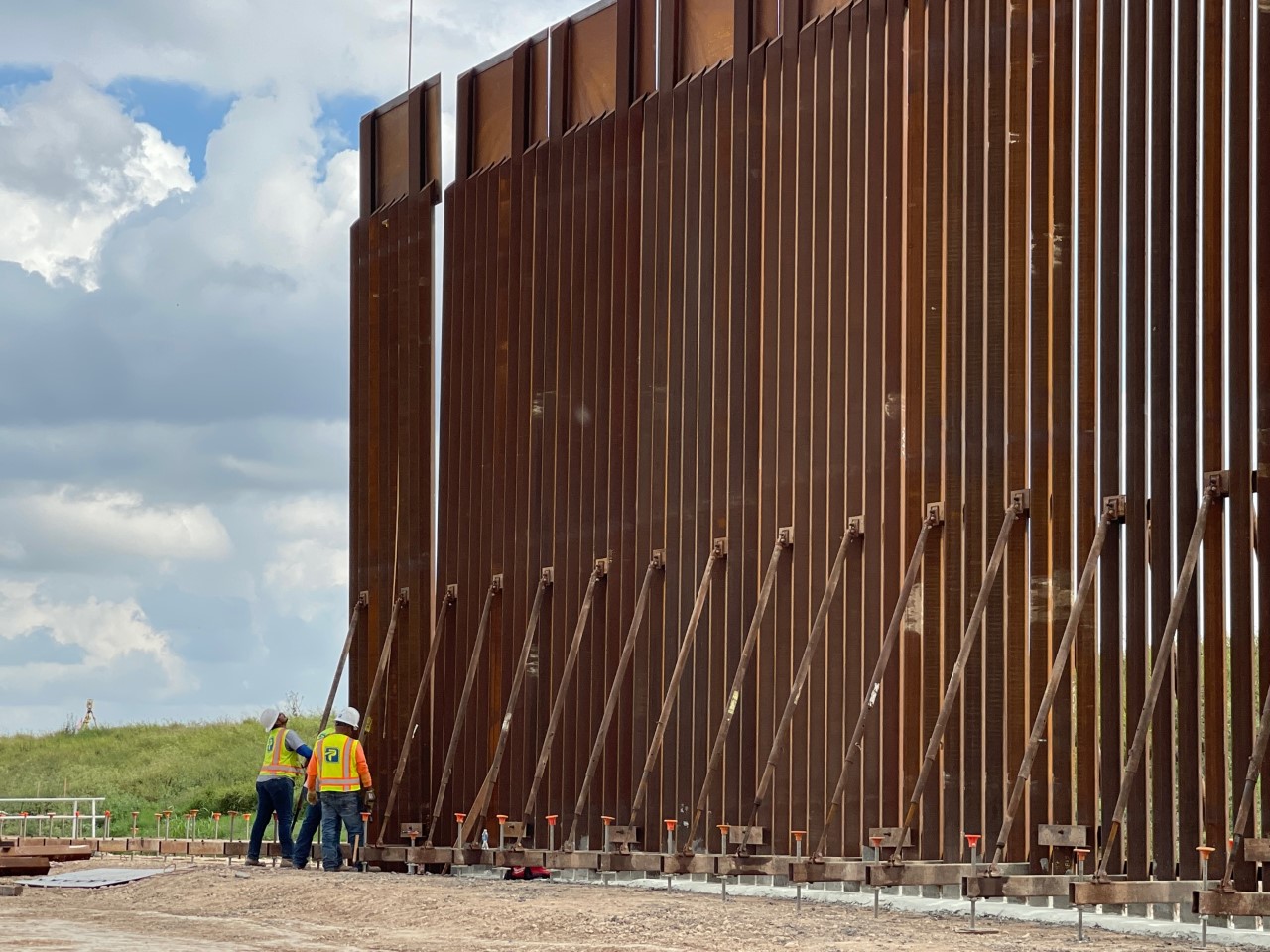 A picture of a construction crew working on a border wall in Texas.