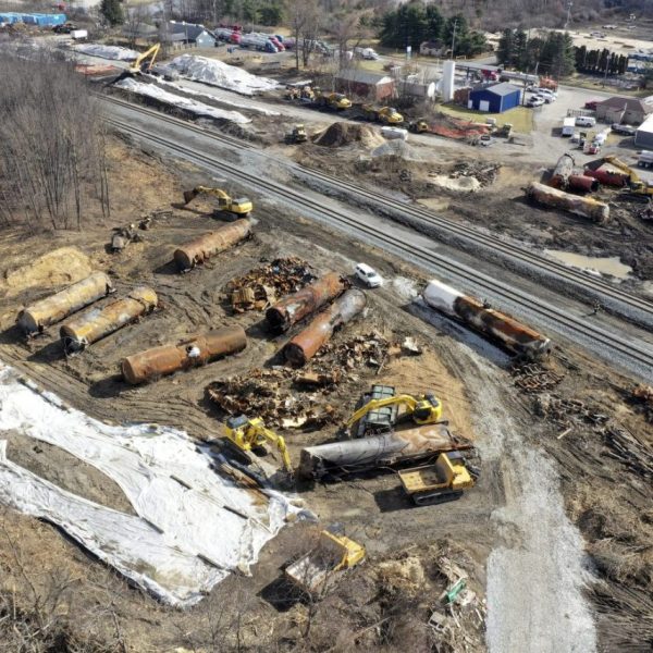 FILE - A view of the scene Friday, Feb. 24, 2023, as the cleanup continues at the site of a Norfolk Southern freight train derailment that happened on Feb. 3, in East Palestine, Ohio. On Tuesday, Feb. 28, in the wake of a fiery Ohio derailment and other recent crashes, federal regulators urged that freight railroads should reexamine the way they use and maintain the detectors along the tracks that are supposed to spot overheating bearings. (AP Photo/Matt Freed, File)