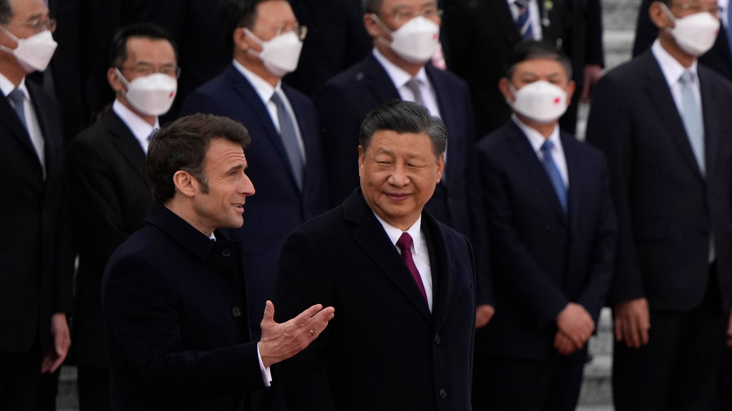 French President Emmanuel Macron, bottom left, chats with Chinese President Xi Jinping during a welcome ceremony held outside the Great Hall of the People in Beijing, Thursday, April 6, 2023. (AP Photo/Ng Han Guan, Pool)