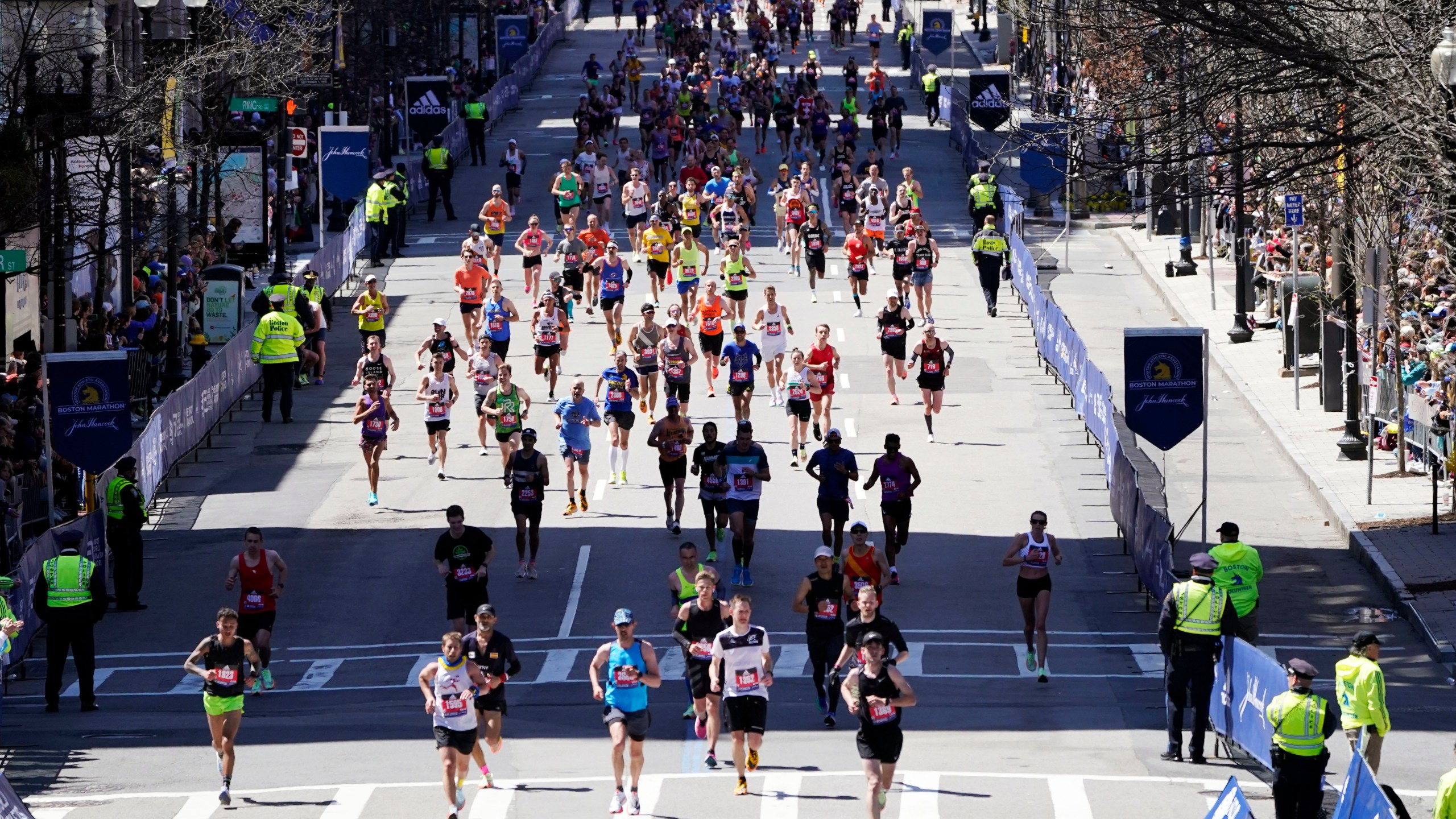 FILE - Runners approach the finish line of the Boston Marathon, Monday, April 18, 2022, in Boston. Massachusetts gambling regulators on Thursday, April 6, 2023, denied a request to allow legal betting on this year's Boston Marathon, citing opposition by the race's organizers as one reason. The state last month started allowing online sports wagering on pro sports and some college sports. (AP Photo/Charles Krupa, File)