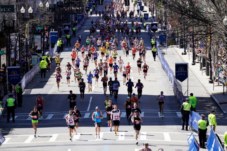 FILE - Runners approach the finish line of the Boston Marathon, Monday, April 18, 2022, in Boston. Massachusetts gambling regulators on Thursday, April 6, 2023, denied a request to allow legal betting on this year's Boston Marathon, citing opposition by the race's organizers as one reason. The state last month started allowing online sports wagering on pro sports and some college sports. (AP Photo/Charles Krupa, File)