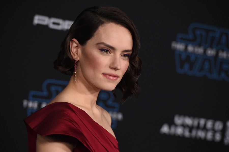 FILE - Daisy Ridley arrives at the world premiere of "Star Wars: The Rise of Skywalker" on Dec. 16, 2019, in Los Angeles. Lucasfilm announced three new live-action films in the "Star Wars" franchise which includes the return of Ridley as Rey. (Jordan Strauss/Invision/AP, File)