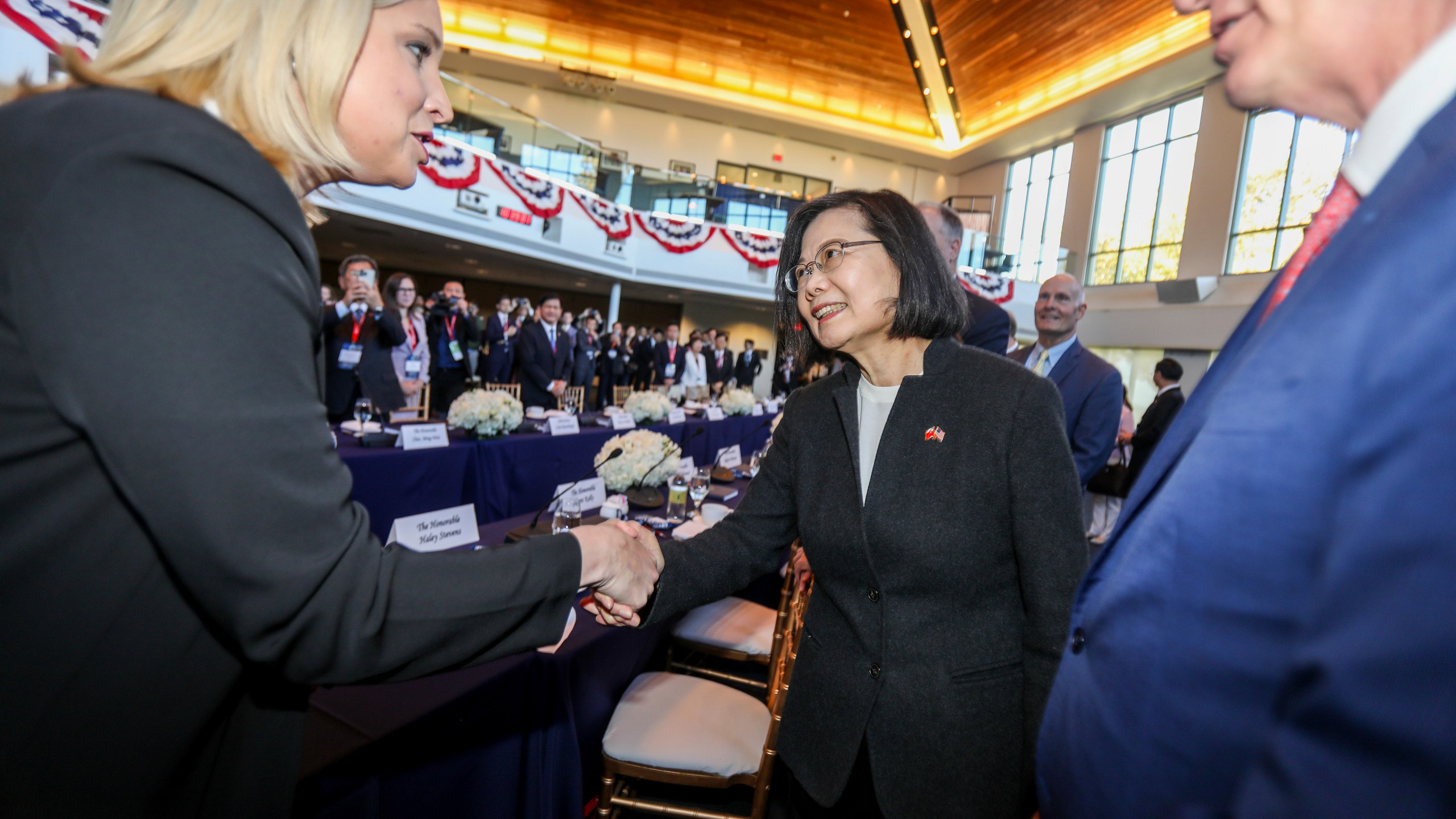 FILE- Taiwan President Tsai Ing-wen, center, is greeted before a Bipartisan Leadership Meeting at the Ronald Reagan Presidential Library in Simi Valley, Calif., on April 5, 2023. China is imposing sanctions against the Ronald Reagan Presidential Library and other U.S.- and Asian-based organizations in retaliation for the closely watched meeting this week between the U.S. House Speaker and Taiwan’s president. (AP Photo/Ringo H.W. Chiu, File)