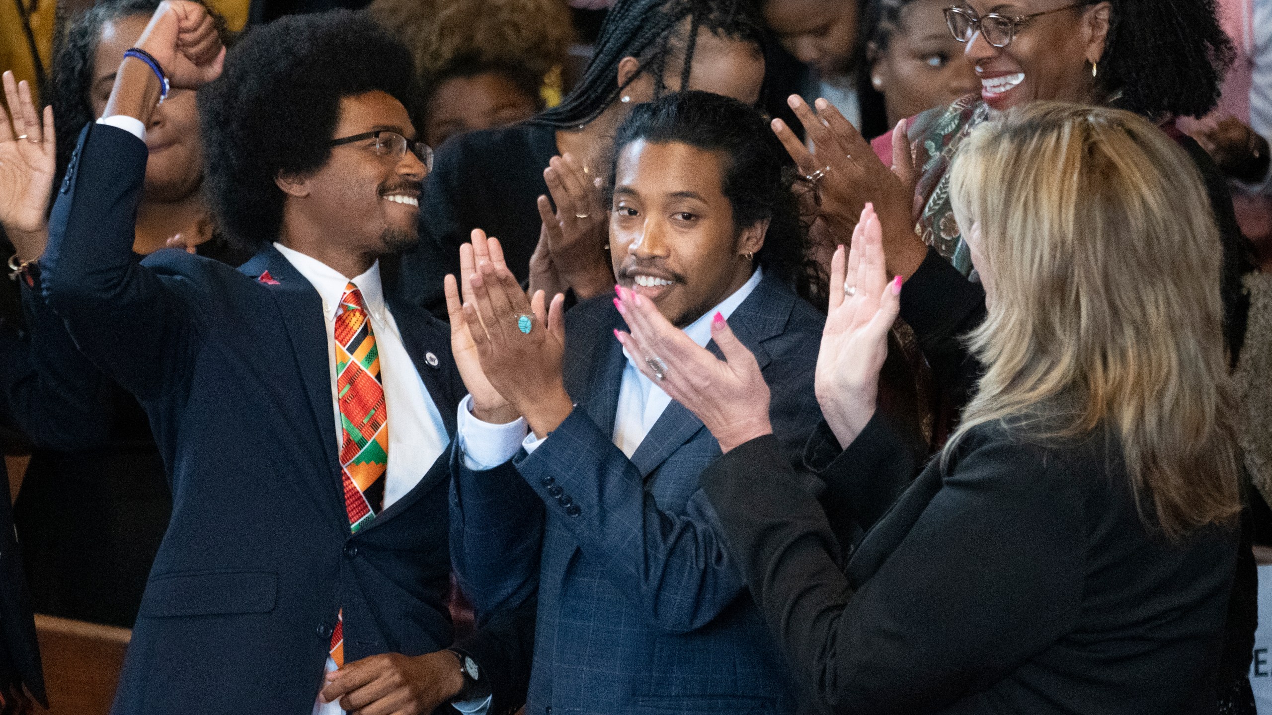 Expelled Rep. Justin Pearson, D-Memphis, from left, expelled Rep. Justin Jones, D-Nashville, and Rep. Gloria Johnson, D-Knoxville, are recognized by the audience at Fisk University before Vice President Kamala Harris arrives, Friday, April 7, 2023, in Nashville, Tenn. (AP Photo/George Walker IV)