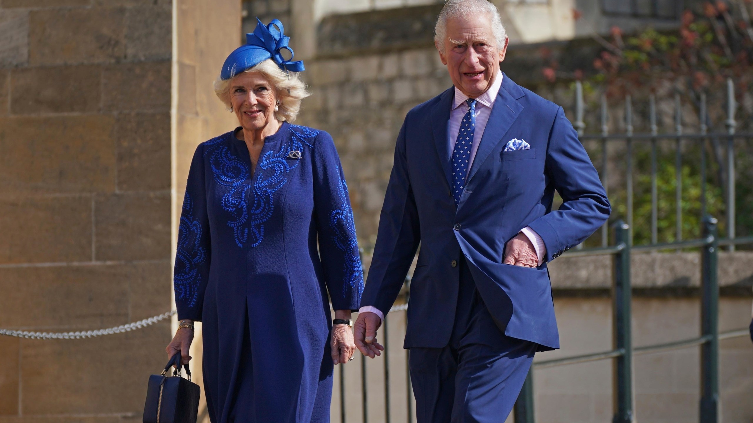 FILE - Britain's King Charles III and Camilla, the Queen Consort attend the Easter Mattins Service at St George's Chapel at Windsor Castle in Windsor, England, Sunday April 9, 2023. King Charles III will be taking a short cut and a smoother ride to Westminster Abbey on May 6, 2023, trimming the procession route his mother took in 1953 as he aims for a more modest coronation that will include some modern touches. (Yui Mok/Pool via AP, File)