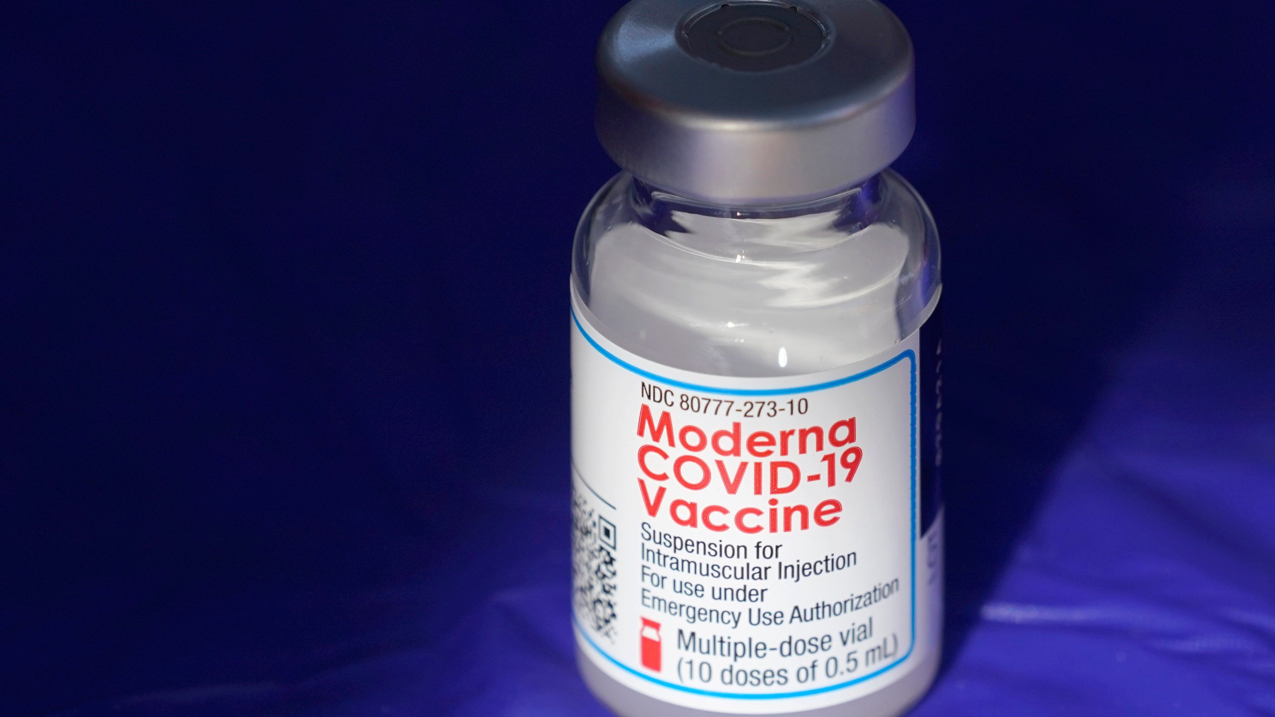 FILE - In this March 4, 2021 file photo, a vial of the Moderna COVID-19 vaccine rests on a table at a drive-up mass vaccination site in Puyallup, Wash., south of Seattle. Moderna shares slipped Tuesday, April 11, 2023, after the COVID-19 vaccine developer said its potential flu vaccine needs more study in a late-stage clinical trial. (AP Photo/Ted S. Warren, File)