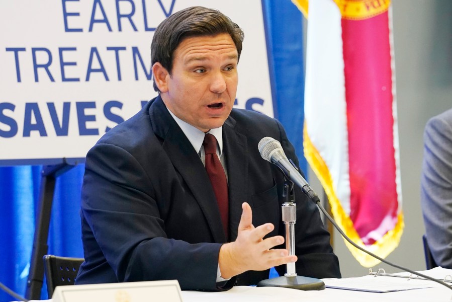 FILE - Florida Gov. Ron DeSantis complains about the FDA's decision to revoke its emergency authorization for two COVID-19 monoclonal antibody treatments during a press conference on Jan. 26, 2022, in North Miami, Fla. (AP Photo/Marta Lavandier, File)