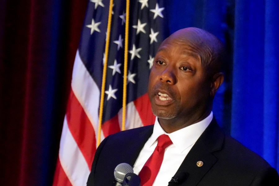 FILE - Sen. Tim Scott, R-S.C., gives a speech at a Black History Month dinner hosted by the Charleston County GOP on Feb. 16, 2023, in Charleston, S.C. Scott is taking the next official step toward a bid for president in 2024. The Republican is set to announce the formation of an exploratory committee, according to a person familiar with his plans who spoke with The Associated Press, Tuesday, April 11, 2023, on the condition on anonymity so as not to get ahead of the official announcement. (AP Photo/Meg Kinnard, File)