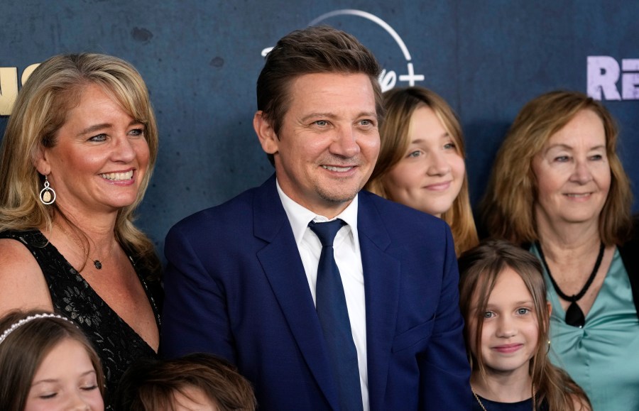 Jeremy Renner, center, the host and executive producer of "Rennervations," is surrounded by family members at the premiere of the four-part Disney+ docuseries, Tuesday, April 11, 2023, at the Westwood Regency Village Theatre in Los Angeles. The premiere marked Renner's first public, in-person appearance since a Jan. 1 snow plow accident outside his Reno, Nev., home left him with life-threatening injuries. (AP Photo/Chris Pizzello)