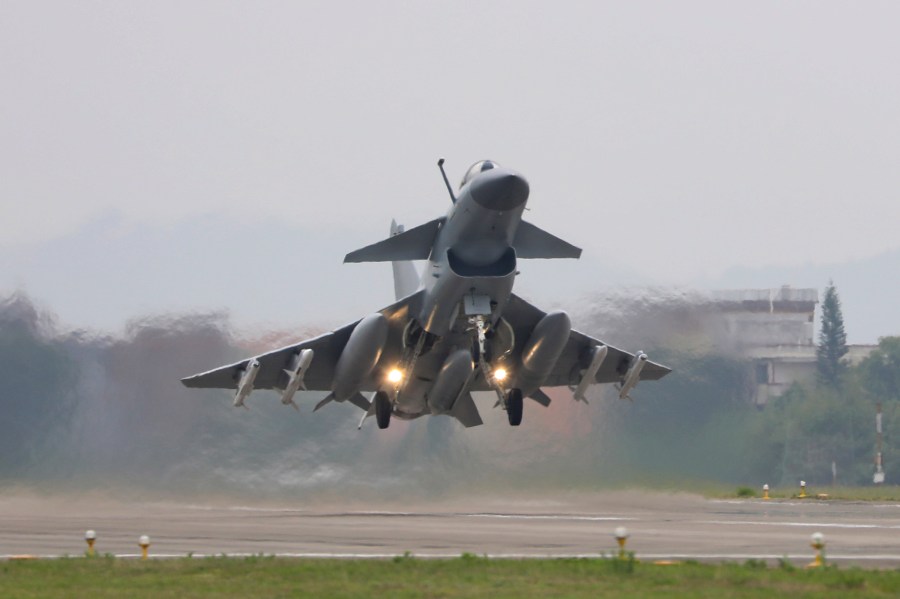 In this photo released by Xinhua News Agency, a fighter takes off during the combat readiness patrol and military exercises around the Taiwan Island carried out by the Eastern Theater Command of the Chinese People's Liberation Army (PLA) from Nanjing in eastern China on April 8, 2023. Recent Chinese air and sea drills simulating an encirclement of Taiwan were intended as a "serious warning" to pro-independence politicians on the self-governing island and their foreign supporters, a Chinese spokesperson said Wednesday, April 12, 2023. (Wang Zixiao/Xinhua via AP)