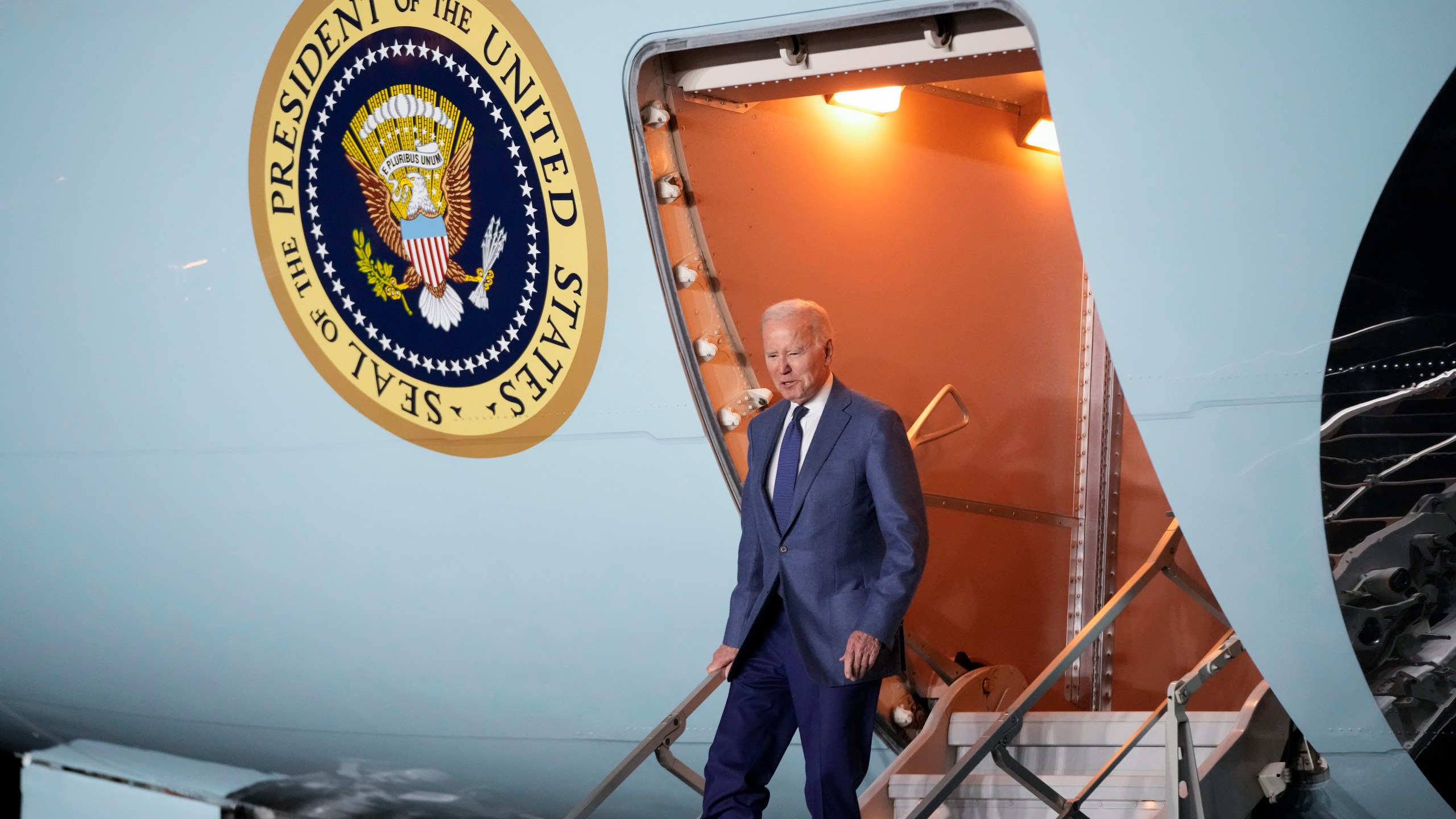 President Joe Biden steps off Air Force One at Belfast International Airport in Belfast, Northern Ireland, Tuesday, April 11, 2023. Biden is visiting the United Kingdom and Ireland in part to help celebrate the 25th anniversary of the Good Friday Agreement. (AP Photo/Patrick Semansky)