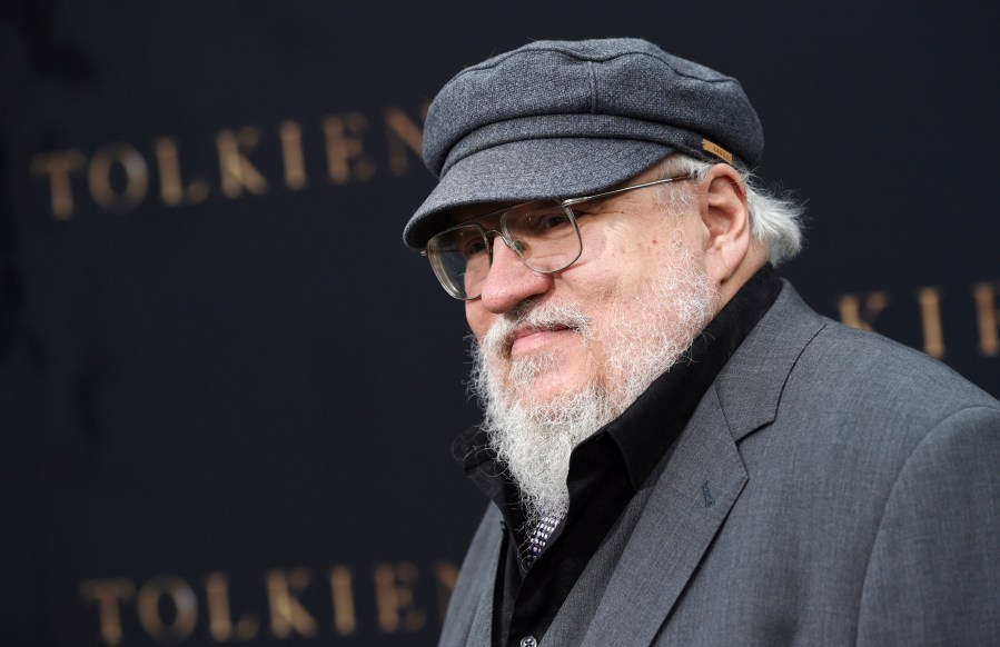 FILE - Author George R.R. Martin poses at the premiere of the film "Tolkien," at the Regency Village Theatre on May 8, 2019, in Los Angeles. Warner Bros. Discovery is sticking with safe bet franchises that will likely lure viewers, including a “Harry Potter” series and a “Game of Thrones” prequel for its rebranded Max streaming service, the company announced Wednesday, April 12, 2023. (Photo by Chris Pizzello/Invision/AP, File)