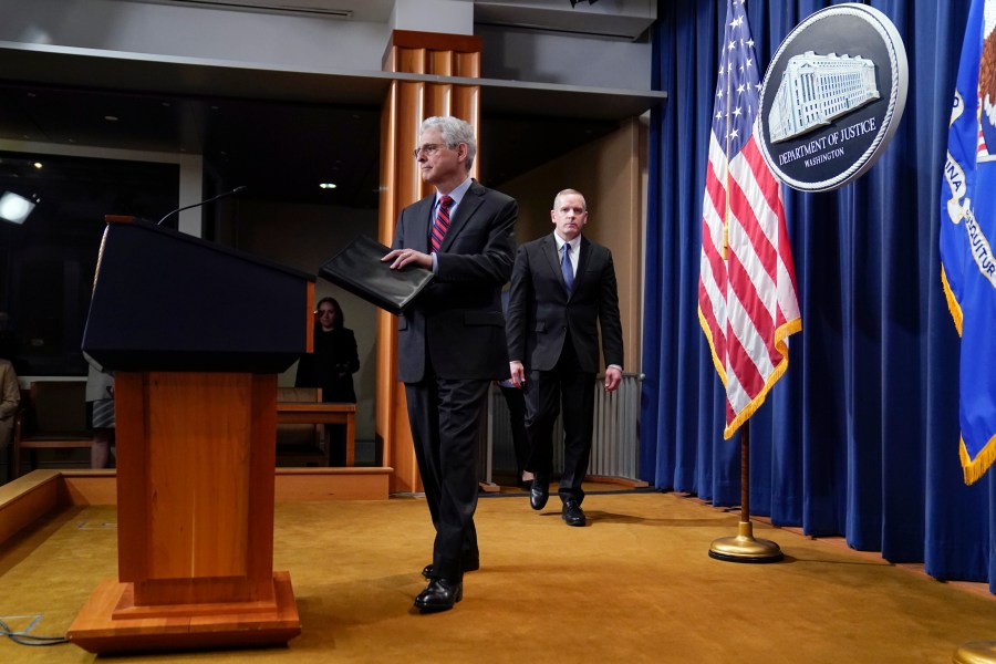 Attorney General Merrick Garland arrives to speak at the Department of Justice in Washington, Thursday, April 13, 2023. Garland announced that a Massachusetts Air National Guard member who has emerged as a main person of interest in the disclosure of highly classified military documents on the Ukraine war was taken into custody Thursday by federal agents. FBI Deputy Director Paul Abbate follows at right. (AP Photo/Evan Vucci)