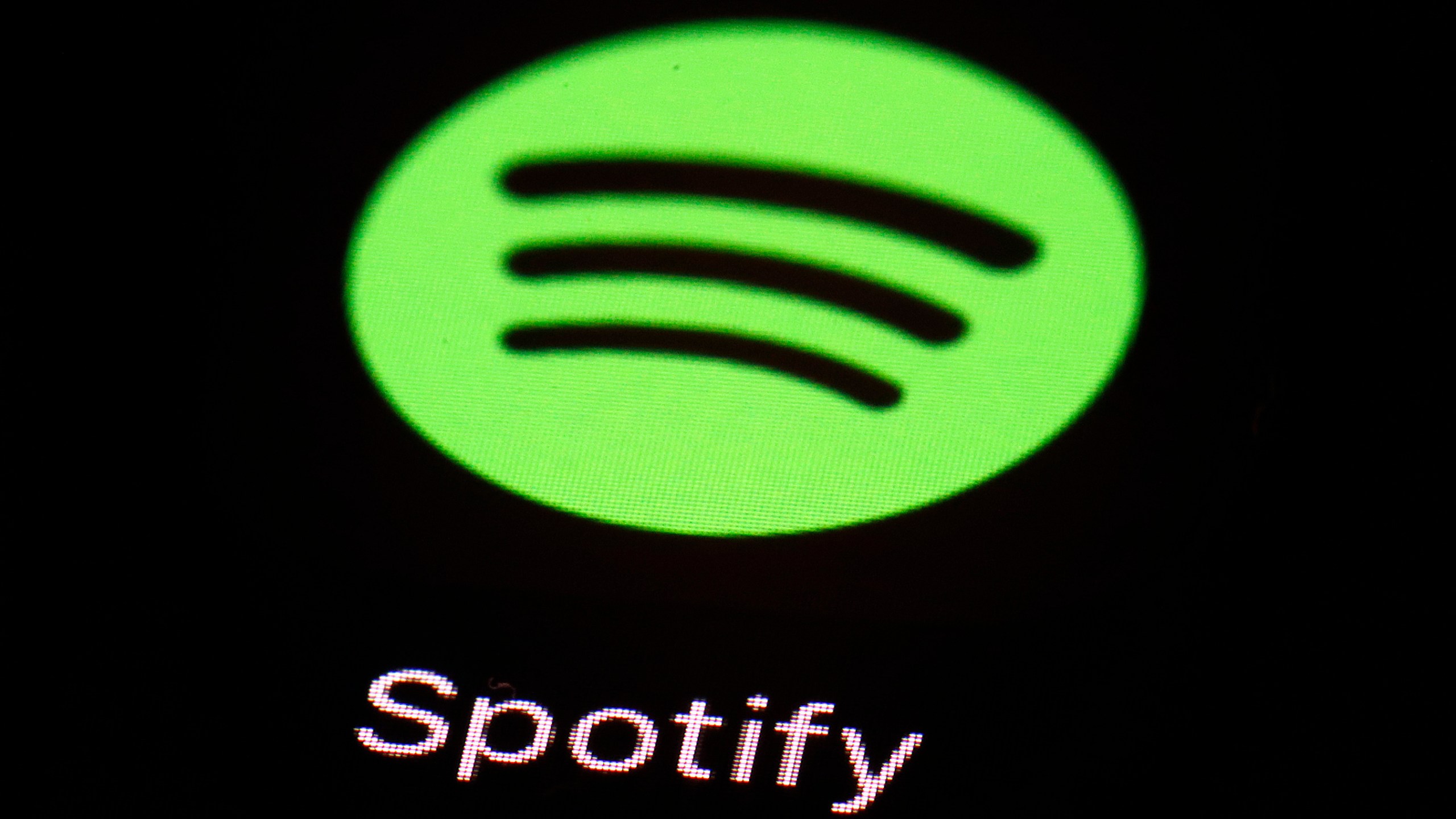 FILE - The Spotify app on an iPad is pictured, March 20, 2018, in Baltimore. Heardle, the name-that-tune game inspired by the Wordle craze, is being dropped by Spotify less than a year after the music-streaming giant acquired it. “After careful consideration, we have made the difficult decision to say goodbye to Heardle," Spotify said in a statement, Saturday, April 15, 2023. (AP Photo/Patrick Semansky, File)