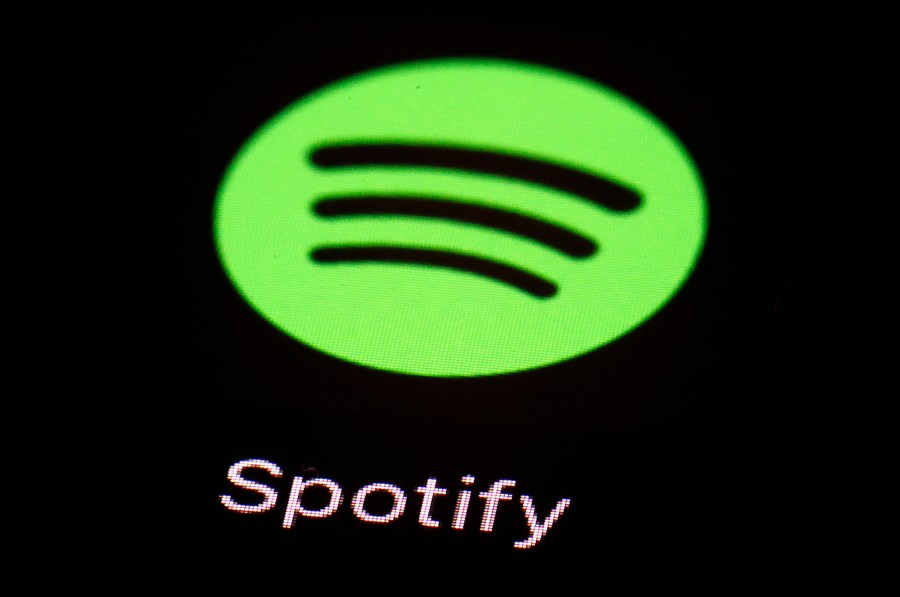 FILE - The Spotify app on an iPad is pictured, March 20, 2018, in Baltimore. Heardle, the name-that-tune game inspired by the Wordle craze, is being dropped by Spotify less than a year after the music-streaming giant acquired it. “After careful consideration, we have made the difficult decision to say goodbye to Heardle," Spotify said in a statement, Saturday, April 15, 2023. (AP Photo/Patrick Semansky, File)