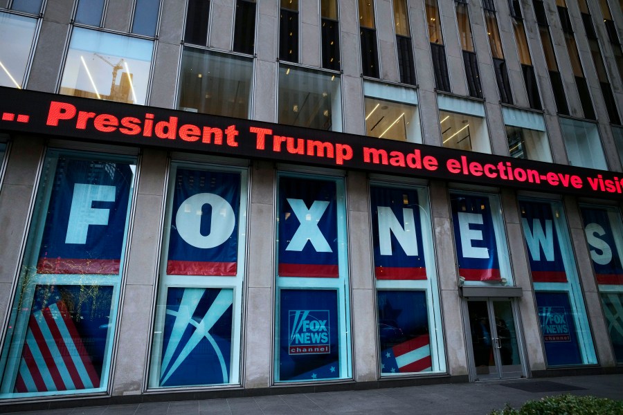 FILE - A headline about President Donald Trump is displayed outside Fox News studios in New York on Nov. 28, 2018. The Delaware judge overseeing Dominion Voting Systems' $1.6 billion defamation lawsuit against Fox News announced late Sunday, April 16, that he was delaying the start of the trial until Tuesday, April 18. He did not cite a reason. The trial, which has drawn international interest, had been scheduled to start Monday morning with jury selection and opening statements. (AP Photo/Mark Lennihan, File)