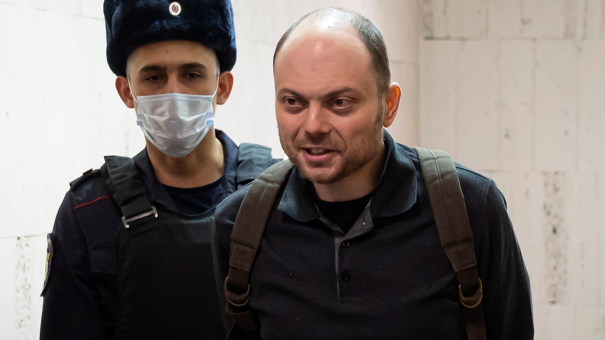 FILE - Russian opposition activist Vladimir Kara-Murza is escorted to a hearing in a court in Moscow, Russia, Feb. 8, 2023. A court in Moscow on Monday April 17, 2023 convicted Kara-Murza, a top Kremlin foe on charges of treason and denigrating the Russian military and sentenced him to 25 years in prison. (AP Photo, File)