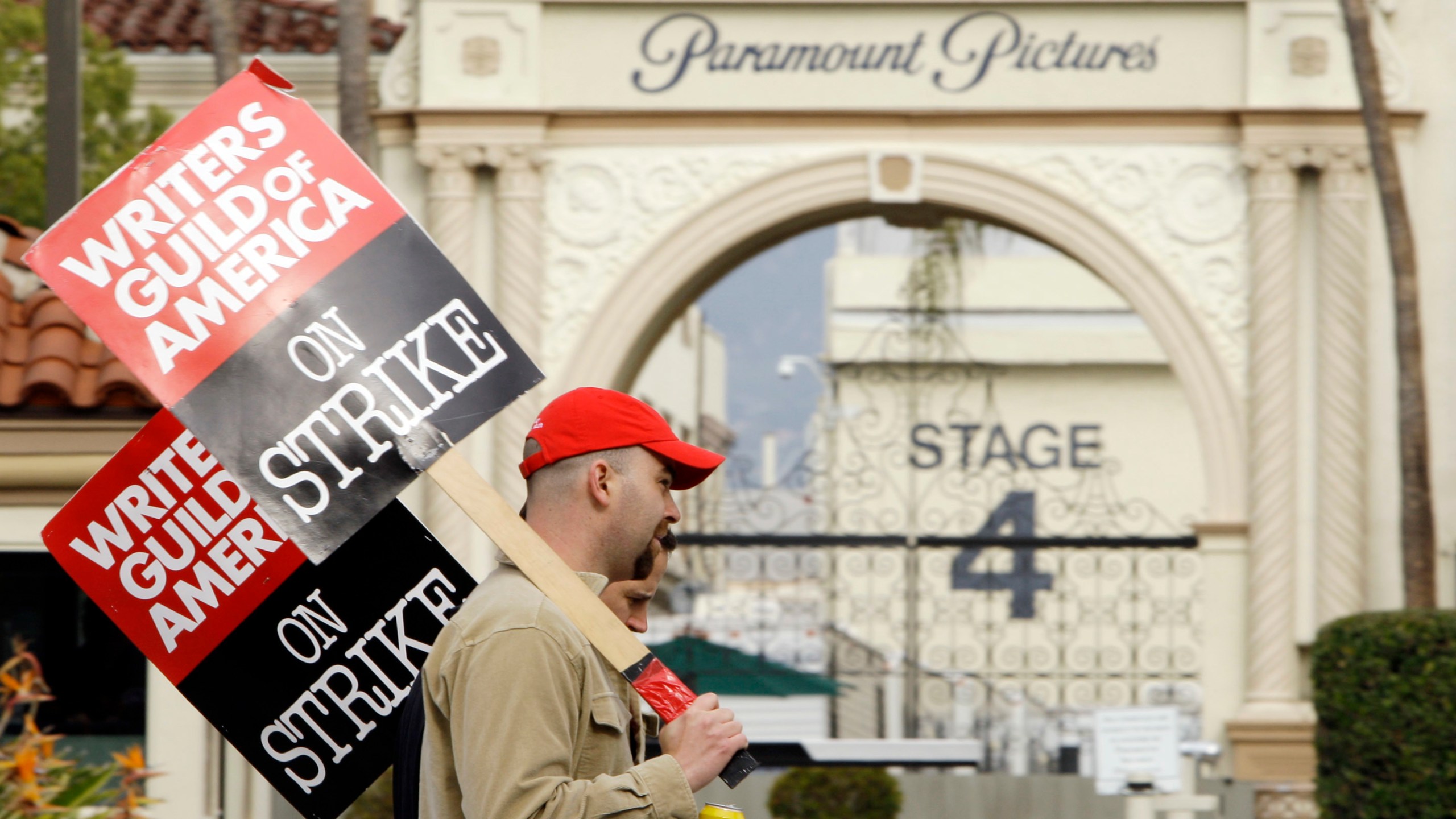 FILE - Striking film and television writers picket outside Paramount Studios on Jan. 23, 2008, in Los Angeles. In an email to members Monday, April 17, 2023, leaders of the Writers Guild of America said nearly 98% of voters said yes to a strike authorization if a new contract agreement is not reached with producers. The guild last went on strike in 2007. (AP Photo/Kevork Djansezian, File)