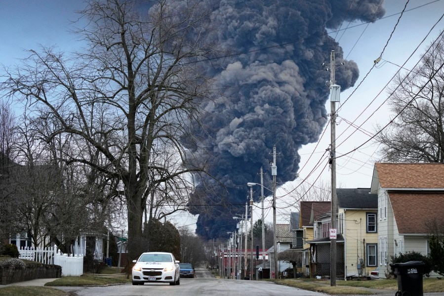 FILE - A black plume rises over East Palestine, Ohio, as a result of a controlled detonation of a portion of the derailed Norfolk Southern trains, on Feb. 6, 2023. Norfolk Southern CEO Alan Shaw is set to testify before an Ohio Senate rail safety panel on Tuesday, April 18, more than two months after the fiery train derailment rocked the village of East Palestine. (AP Photo/Gene J. Puskar, File)