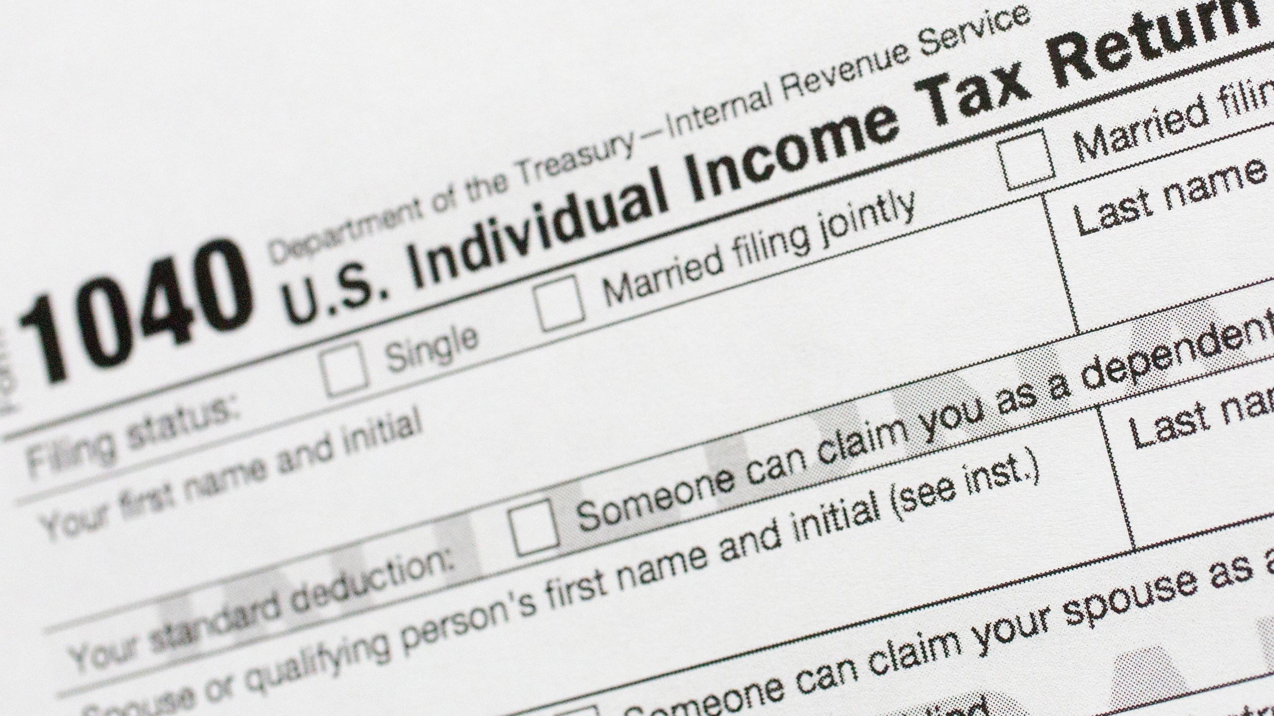 FILE - A portion of the 1040 U.S. Individual Income Tax Return form is shown July 24, 2018, in New York. The IRS has been tasked with looking into how to create a government-operated electronic free-file tax return system for all. Congress has directed the IRS to report in on how such a system might work. (AP Photo/Mark Lennihan, File)