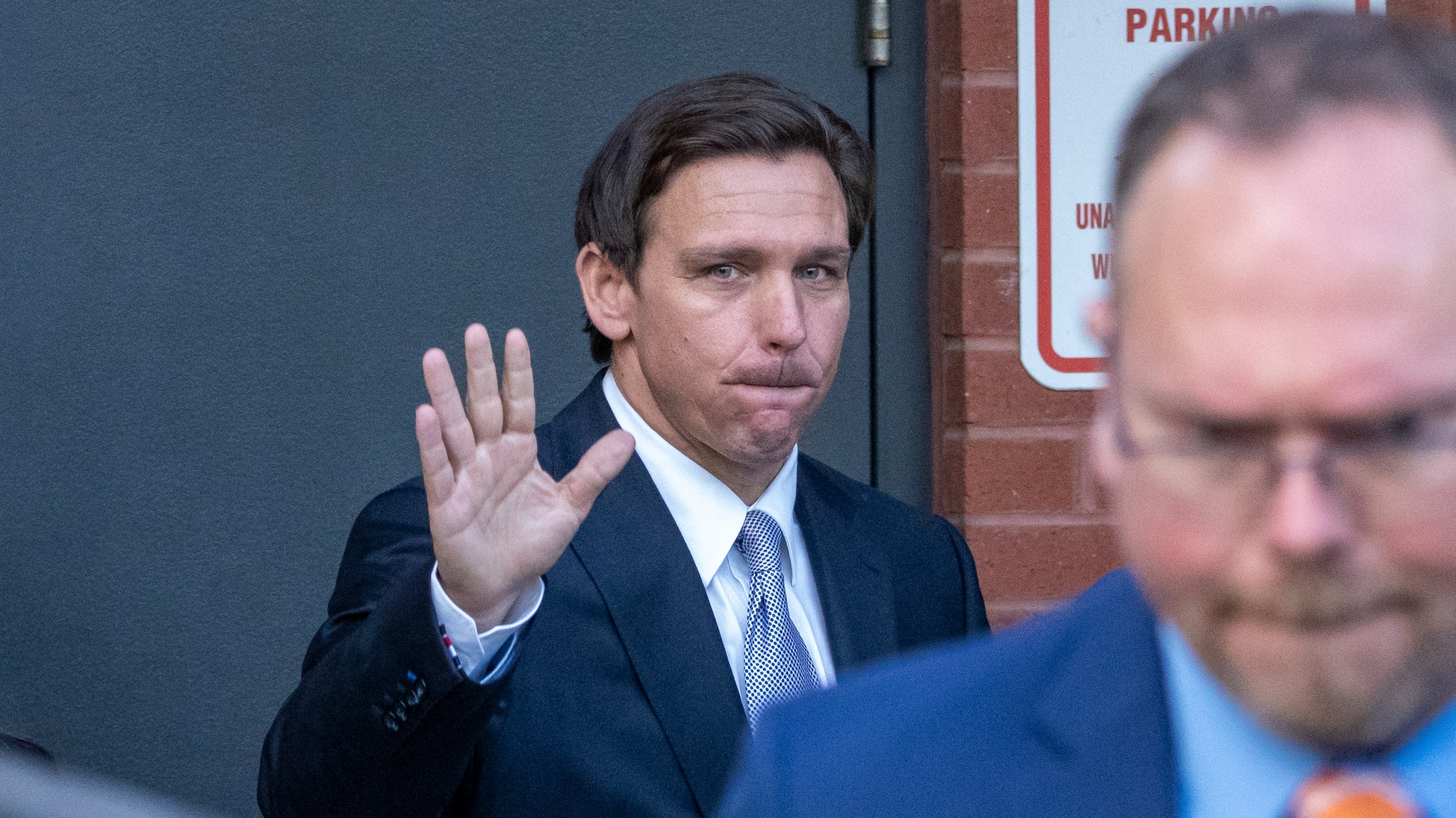 FILE - Florida Gov. Ron DeSantis waves as he departs an event Tuesday, April 18, 2023, in Washington. DeSantis has yet to enter the 2024 presidential race, but former President Donald Trump is aiming to drum up support in the Florida governor's backyard, securing endorsements already from about one-third of the Republicans in the state's congressional delegation. (AP Photo/Alex Brandon, File)