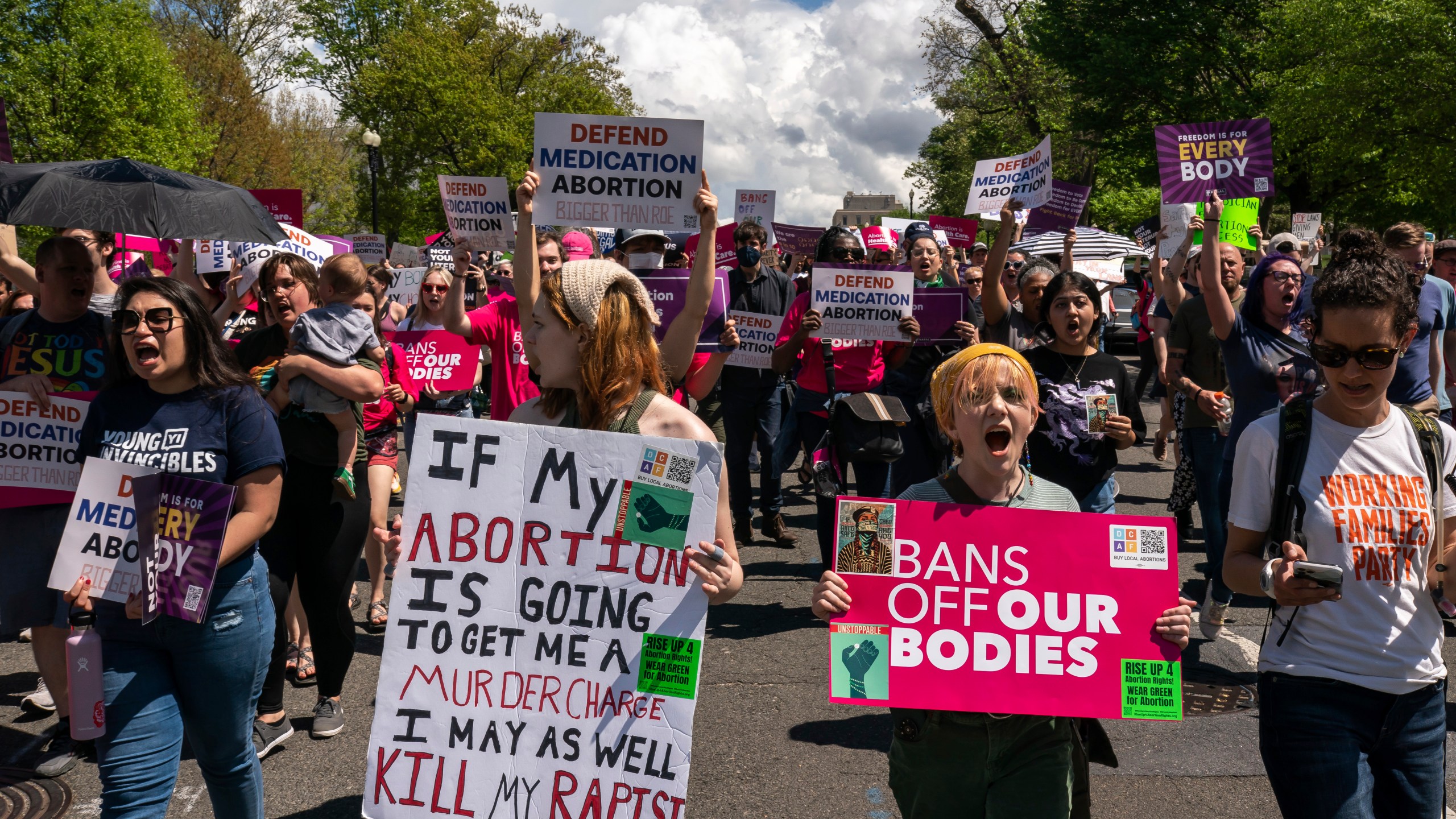 Protesters march past the U.S. Capitol following a Planned Parenthood rally in support of abortion access outside the Supreme Court on Saturday, April. 15, 2023, in Washington. (AP Photo/Nathan Howard)