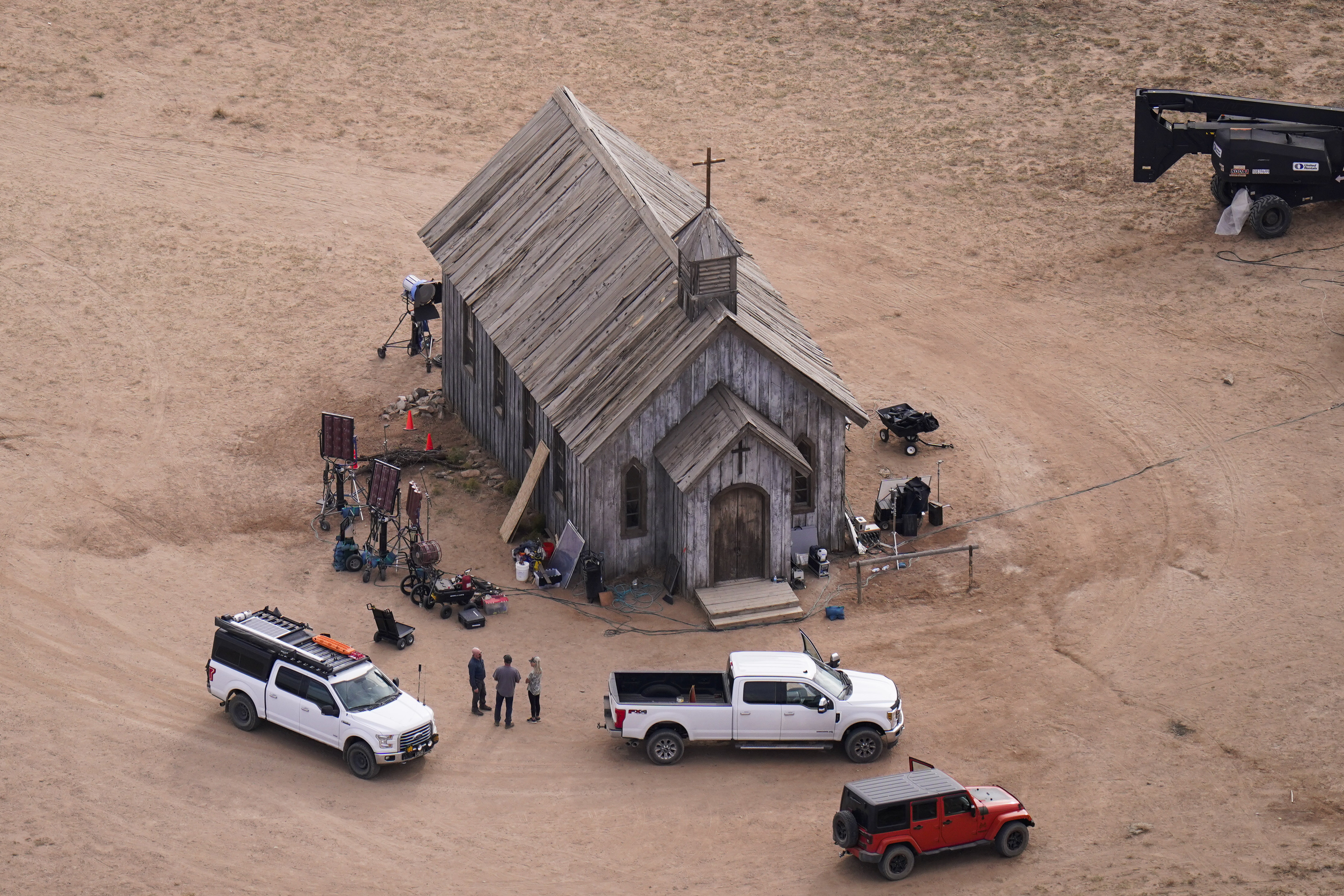 FILE - This aerial photo shows the movie set of "Rust" at Bonanza Creek Ranch in Santa Fe, N.M., on Saturday, Oct. 23, 2021. Prosecutors in New Mexico plan to drop an involuntary manslaughter charge against Alec Baldwin in the fatal 2021 shooting of a cinematographer on the set of the Western film “Rust.” Baldwin’s attorneys said in a statement Thursday that they are pleased with the decision to dismiss the case. (AP Photo/Jae C. Hong, File)