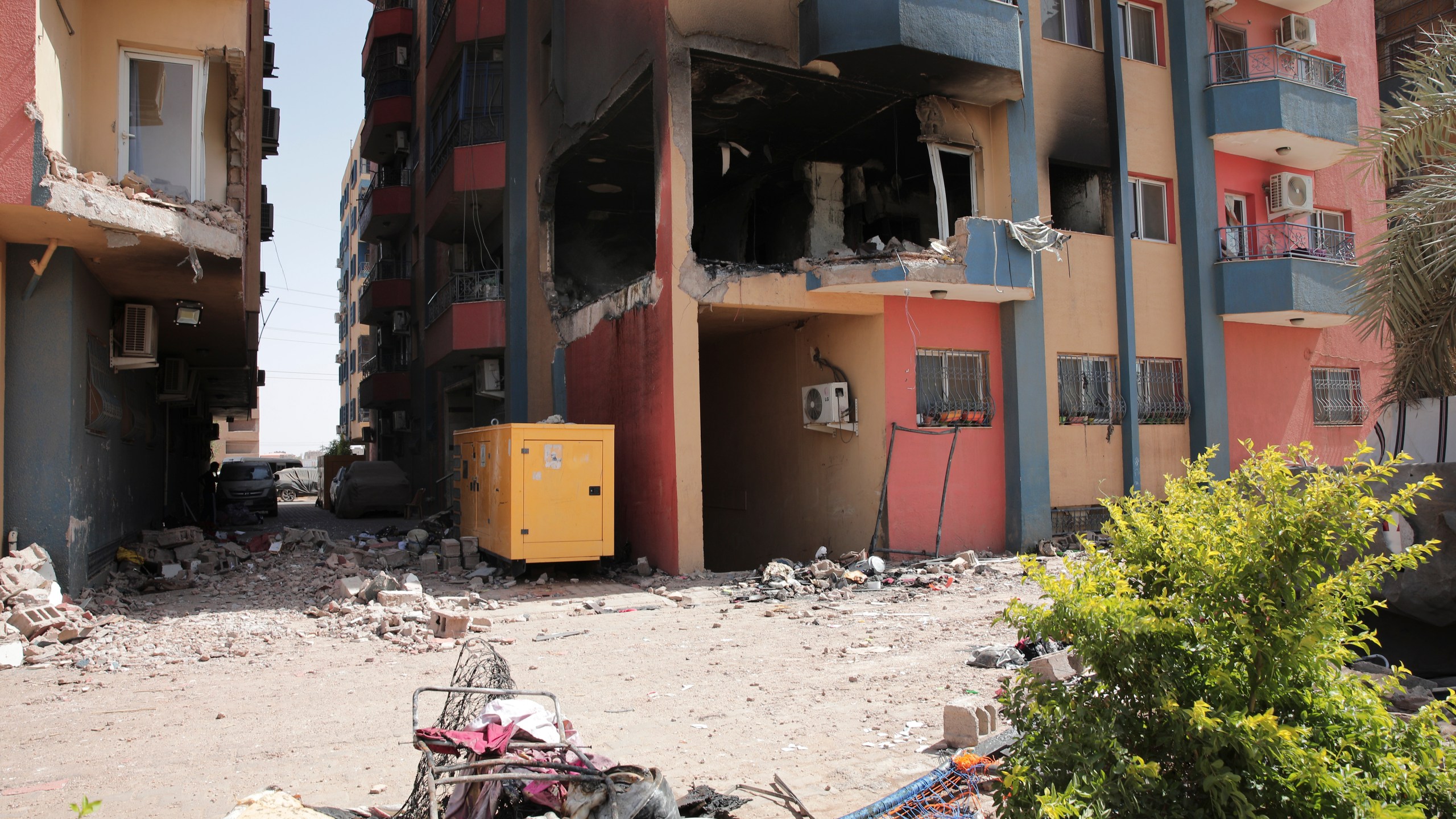 Residential buildings damaged in fighting are seen in Khartoum, Sudan, Thursday, April 20, 2023. The latest attempt at a cease-fire between the rival Sudanese forces faltered as gunfire rattled the capital of Khartoum. Through the night and into Thursday morning, gunfire could be heard almost constantly across Khartoum. (AP Photo/Marwan Ali)