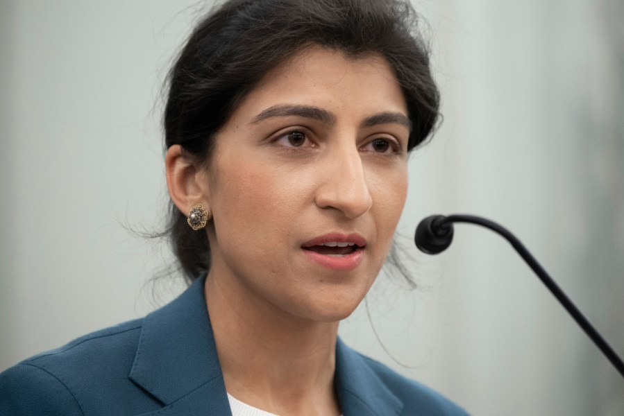 FILE - Lina Khan, then a nominee for Commissioner of the Federal Trade Commission (FTC), speaks during a Senate Committee on Commerce, Science, and Transportation confirmation hearing, April 21, 2021 on Capitol Hill in Washington. The federal government will "not hesitate to crack down" on harmful business practices involving artificial intelligence, Federal Trade Commission head Khan warned Tuesday. (Saul Loeb/Pool via AP, File)