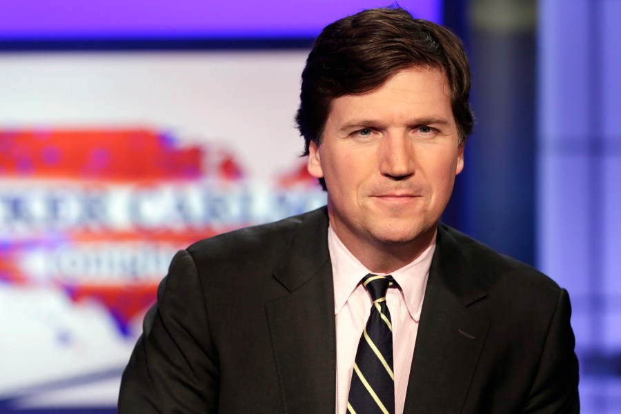 FILE - Tucker Carlson, host of "Tucker Carlson Tonight," poses for photos in a Fox News Channel studio on March 2, 2017, in New York. Fox News says it has agreed to part ways with Tucker Carlson, less than a week after settling a lawsuit over the network’s 2020 election reporting. The network said in a press release Monday that the popular and controversial prime-time host's last program aired on Friday. (AP Photo/Richard Drew, File)