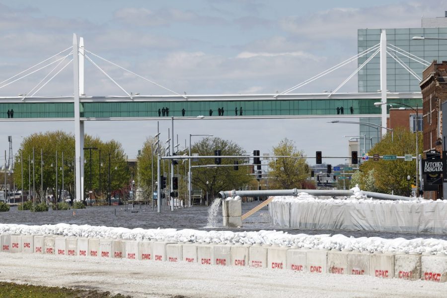 A look down River Drive as the Mississippi River flows through downtown Davenport, Iowa, Saturday, April 29, 2023. The Upper Mississippi River will rise to near record-high levels as it flows through Wisconsin and Iowa. (Nikos Frazier/Quad City Times via AP)