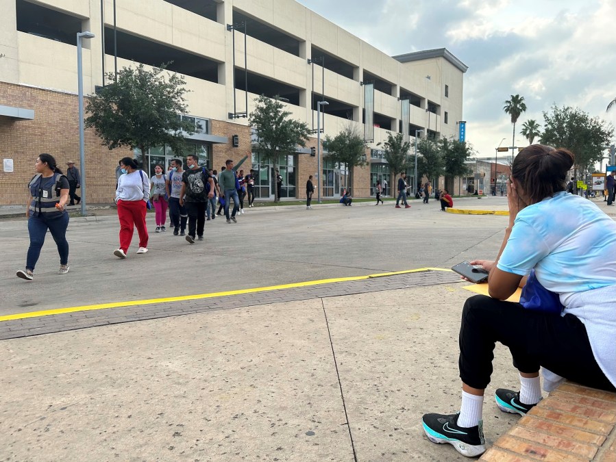 A group of people leave a welcome center for migrants in Brownsville, Texas, Friday, April 28, 2023. The city of Brownsville signed a disaster declaration after nearly 15,000 migrants crossed through the area, with many of them screened and released from federal custody and into the city. (AP Photo/Valerie Gonzalez)