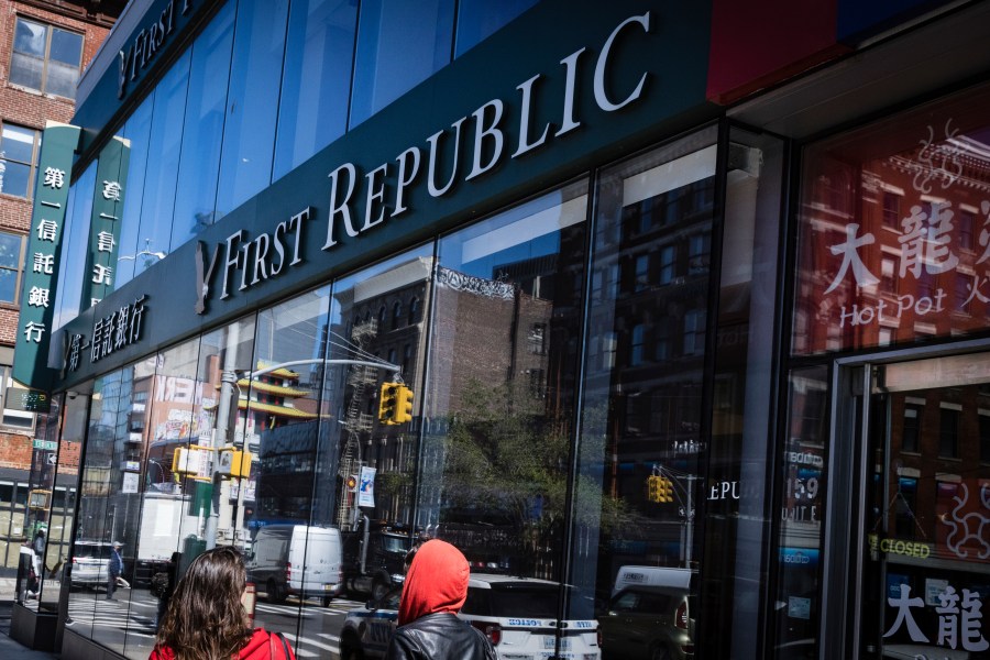 People walk past a First Republic Bank in New York, Monday, May 1, 2023. Regulators seized the troubled First Republic Bank early Monday, making it the second-largest bank failure in U.S. history, and promptly sold all of its deposits and most of its assets to JPMorgan Chase in a bid to stop further banking turmoil that has dominated the first half of this year. (AP Photo/Stefan Jeremiah)