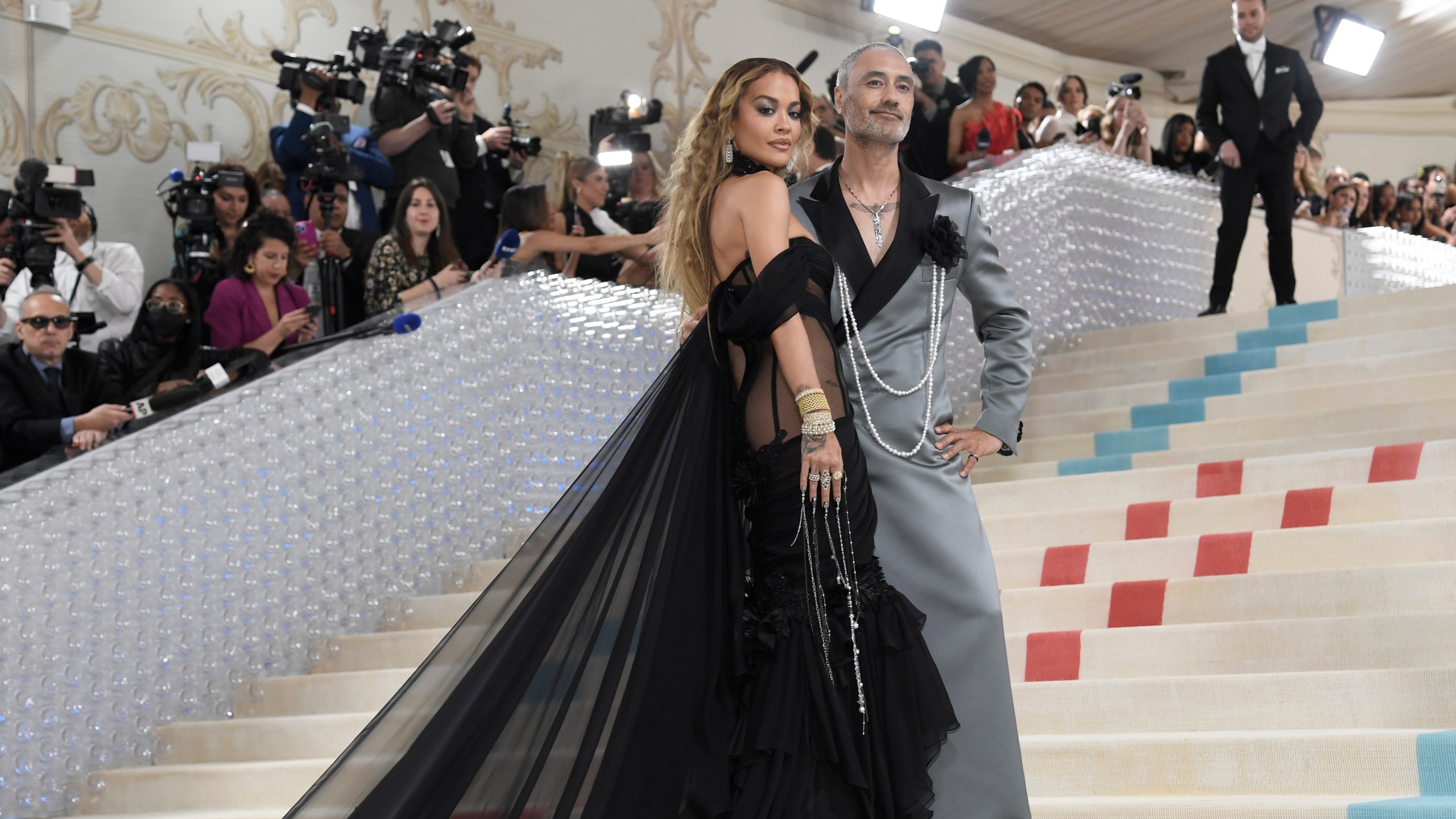 Rita Ora, left, and Taika Waititi attend The Metropolitan Museum of Art's Costume Institute benefit gala celebrating the opening of the "Karl Lagerfeld: A Line of Beauty" exhibition on Monday, May 1, 2023, in New York. (Photo by Evan Agostini/Invision/AP)